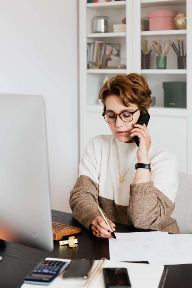 file-claim young red-haired woman talking on phone